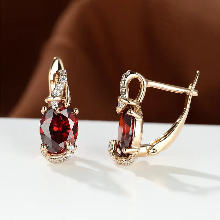 Elegant gold earrings with crimson pendants