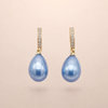 Soft Waves gold-colored earrings with blue cubic zirconia