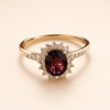 Elegant gold ring with red cubic zirconia