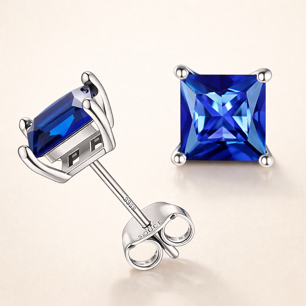 Elegant white gold earrings with princess-cut sapphire