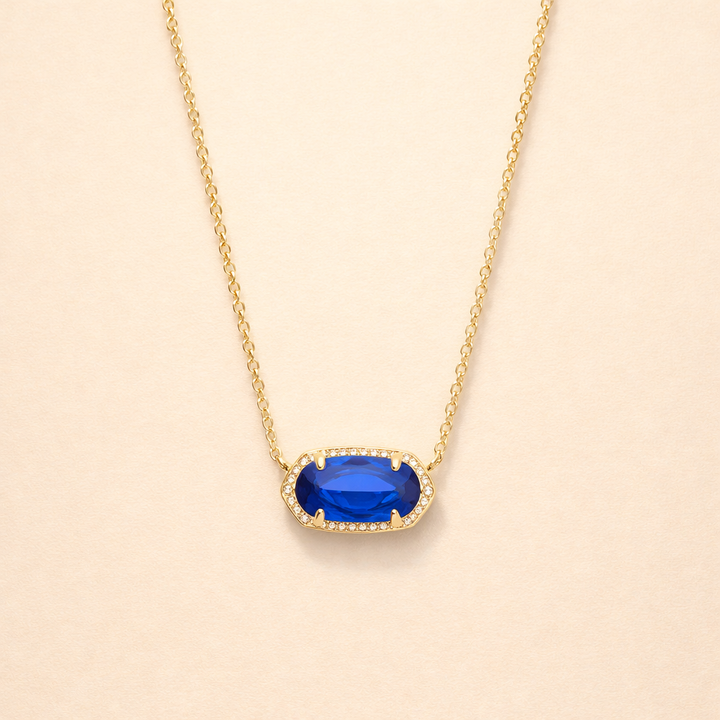 Elegant gold necklace with oval sapphire