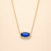 Elegant gold necklace with oval sapphire