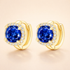 Soft gold earrings with sapphire detail
