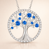 Elegant white gold pendant with sapphire and tree of life