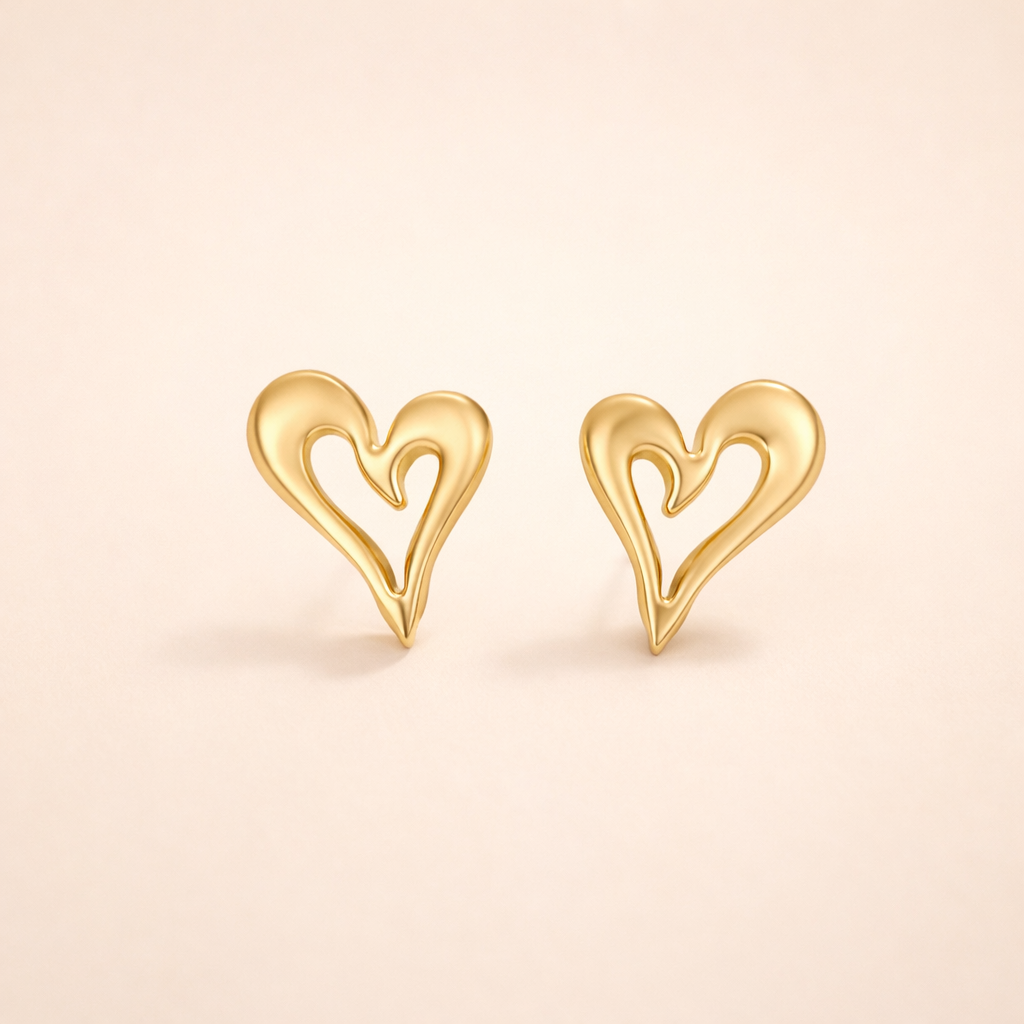 Elegant gold earrings with little heart