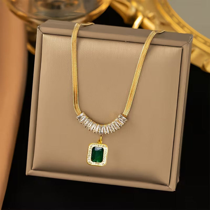 Elegant Gold Pendant with Emerald Prism