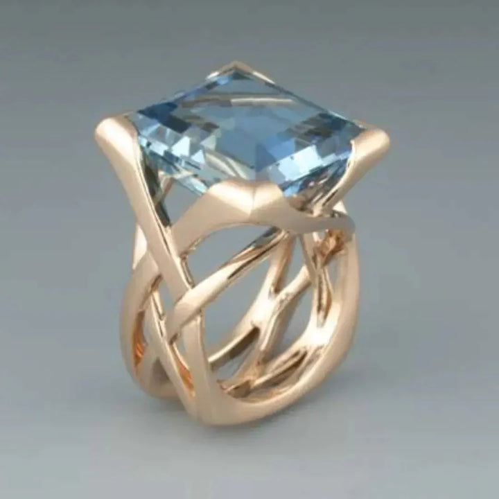 Elegant rose gold ring with blue cubic zirconia
