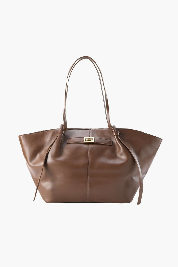 Everyday leather tote with a clasp detail on the front.