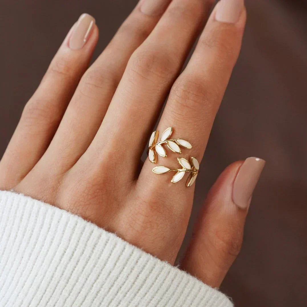 Simple silver ring with white opal leaf motif