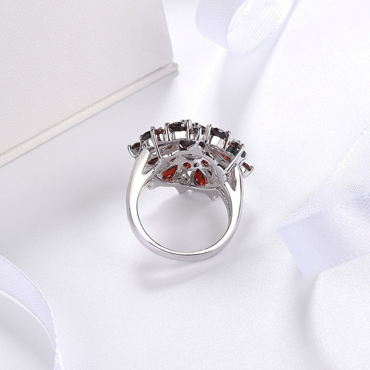 Elegant gold ring with scarlet petals