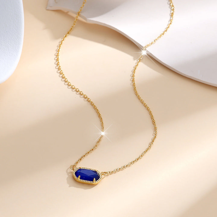 Elegant gold necklace with oval sapphire