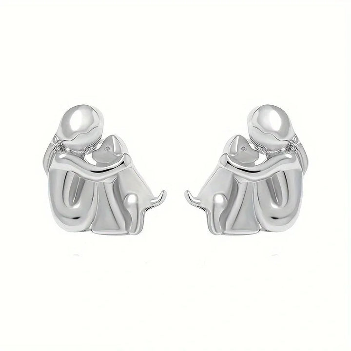 Minimalist silver earrings with subtle round shapes