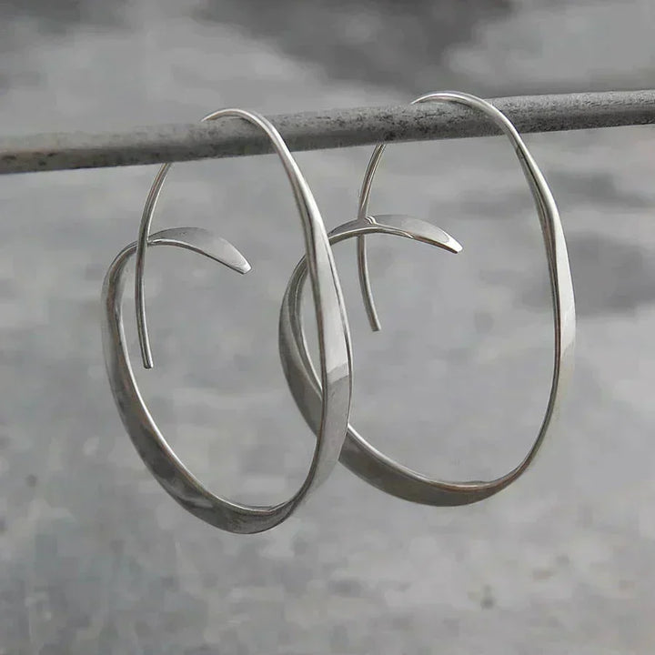 Elegant Gold Earrings with a Refined Spiral Shape