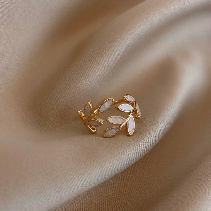 Simple silver ring with white opal leaf motif