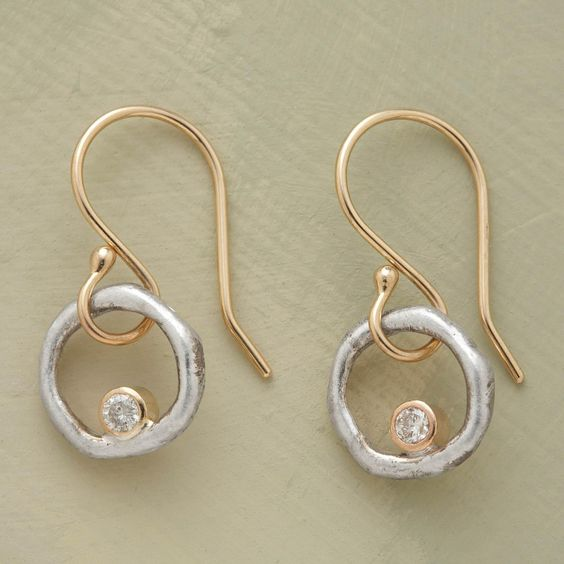 Elegant Gold and Silver Earrings with a Refined Design