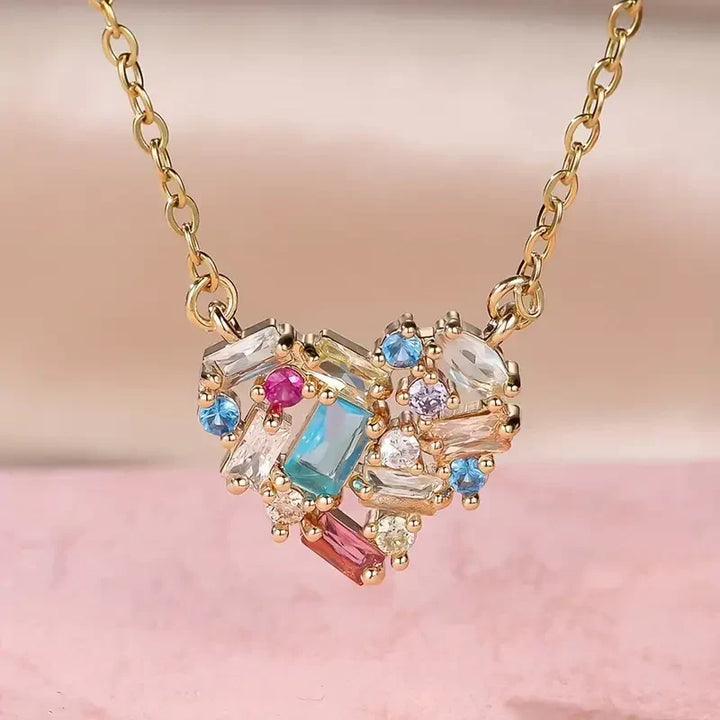 Elegant gold necklace with colorful little heart