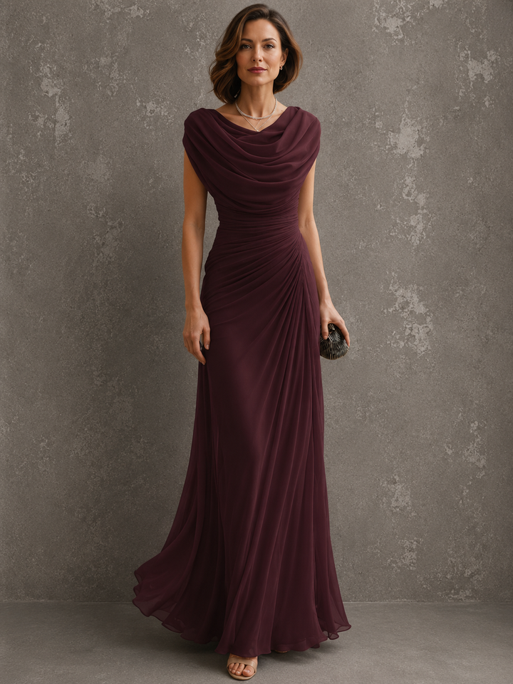 Draped sleeveless maxi dress with flowing floor-length skirt