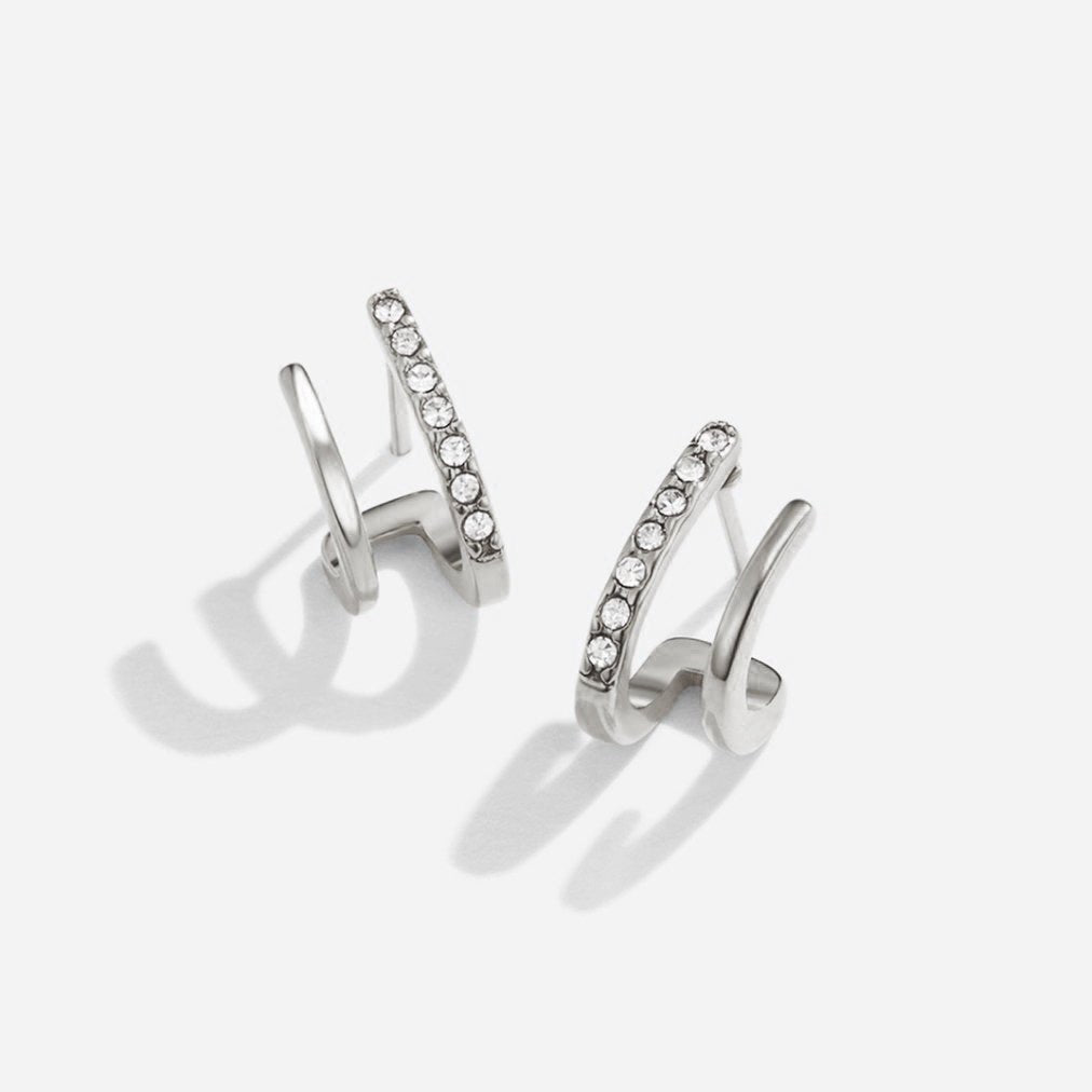 Elegant silver earrings with crystal claw design